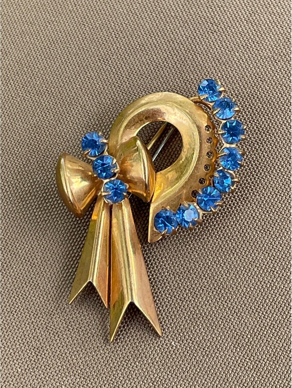 Vintage Art Deco gold and blue rhinestone bow pin